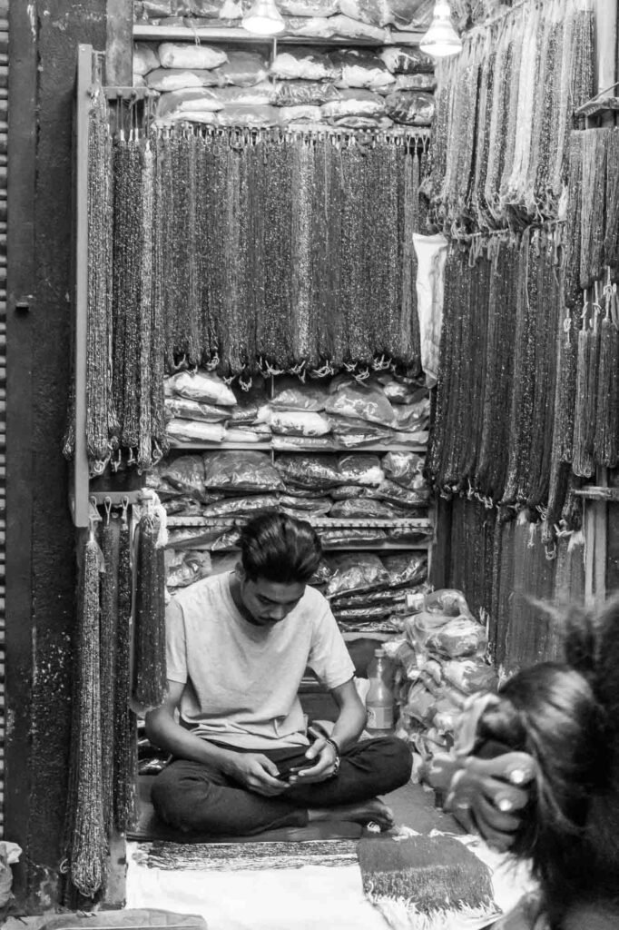 Jewelery shopkeeper in his shop.