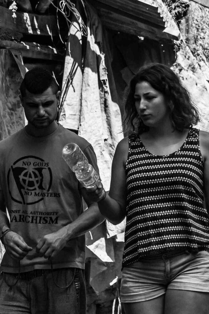 A pair of tourist walking in the street.