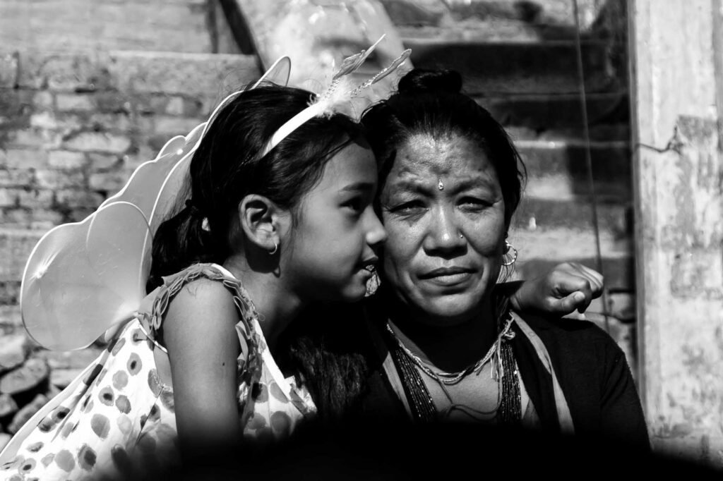 Grandmother and Granddaughter portrait while watching to the street.