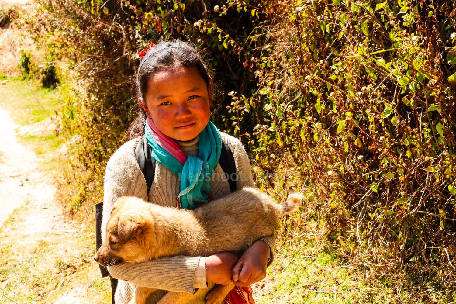 Girl Carrying a Lamb